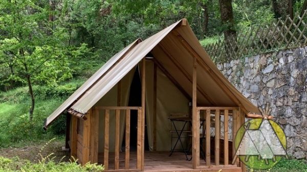 Canvas and wooden lodge tent at camping Le canal de Berry***