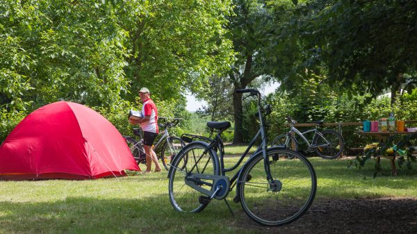 A cyclist taking a break at the campsite